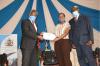 The Vice Chancellor Prof. Kiama issues certificates to sports men and women of the University of Nairobi