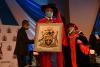The members of staff and invited guests applauds the Vice Chancellor